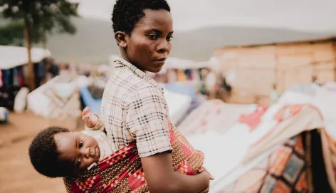 Congolese refugee living in the Busuma camp with her child Promesse.